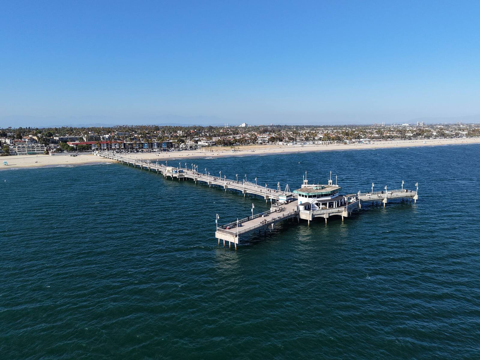 Belmont Pier — aerial view looking along the pier toward the Long Beach coastline and beach
