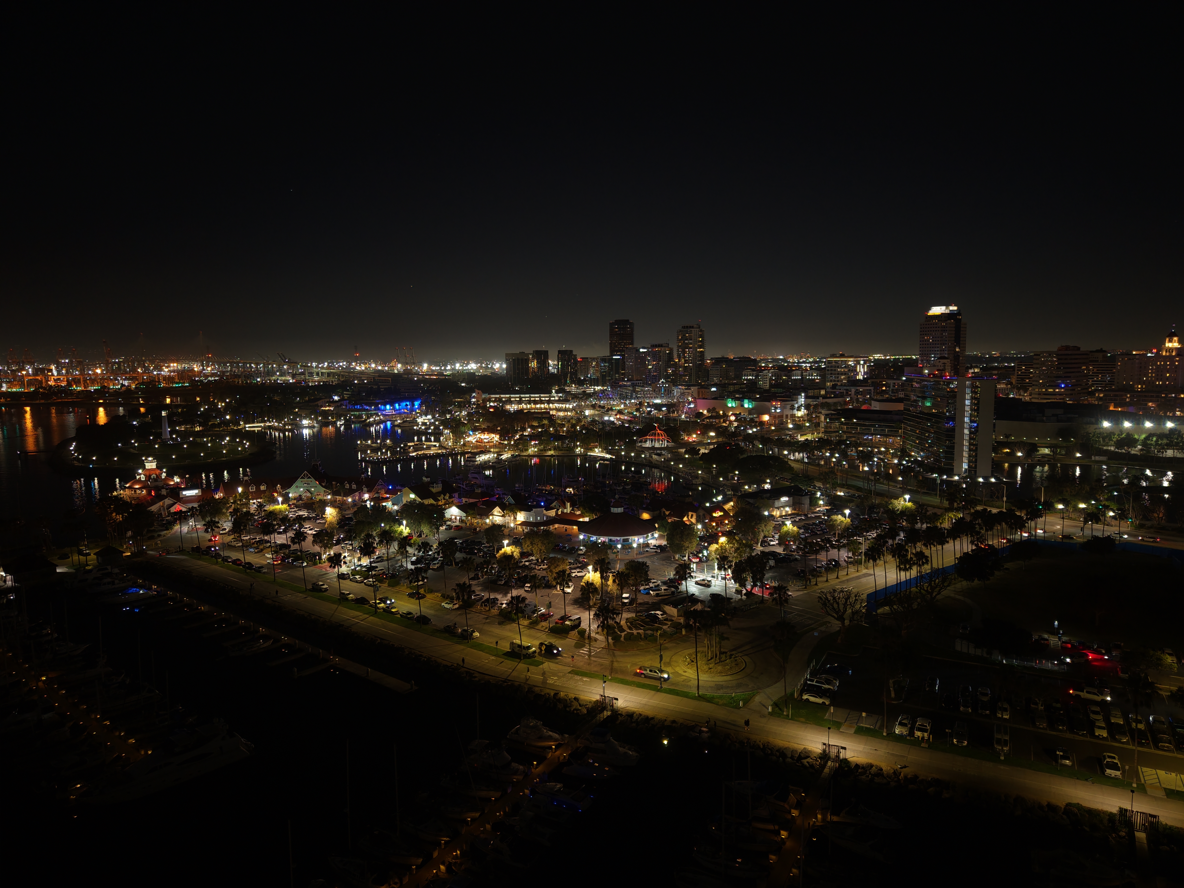 Shoreline Village at Night — aerial view of Rainbow Harbor and the Long Beach waterfront lit up after dark